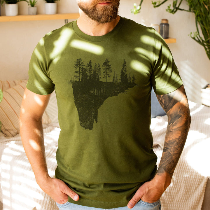 a man with a beard wearing a green shirt