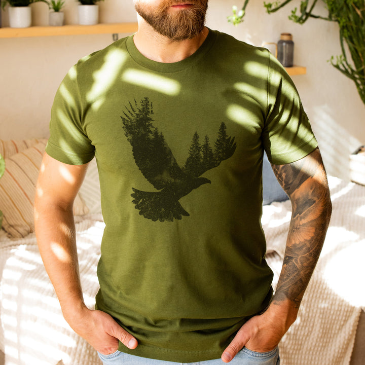 a man with a beard wearing a green t - shirt