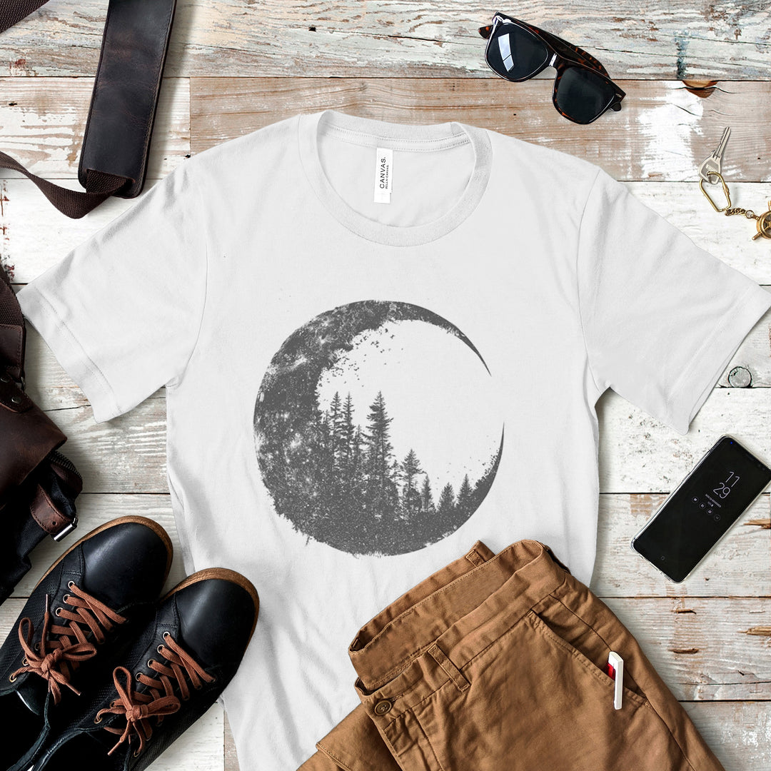 a t - shirt with a picture of the moon and trees on it