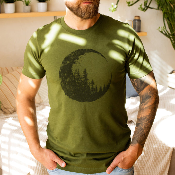 a man with a beard wearing a green shirt