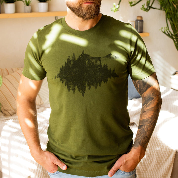 a man with a beard wearing a green shirt