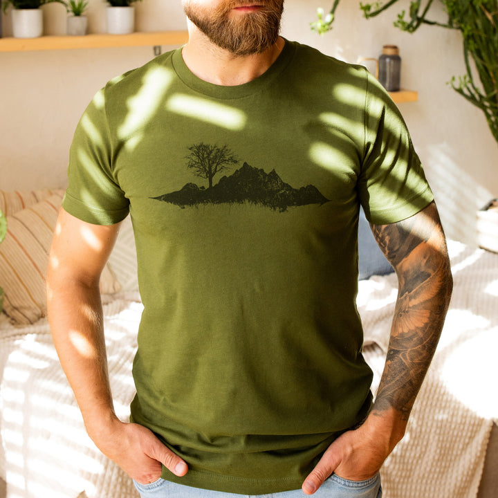 a man with a beard wearing a green shirt